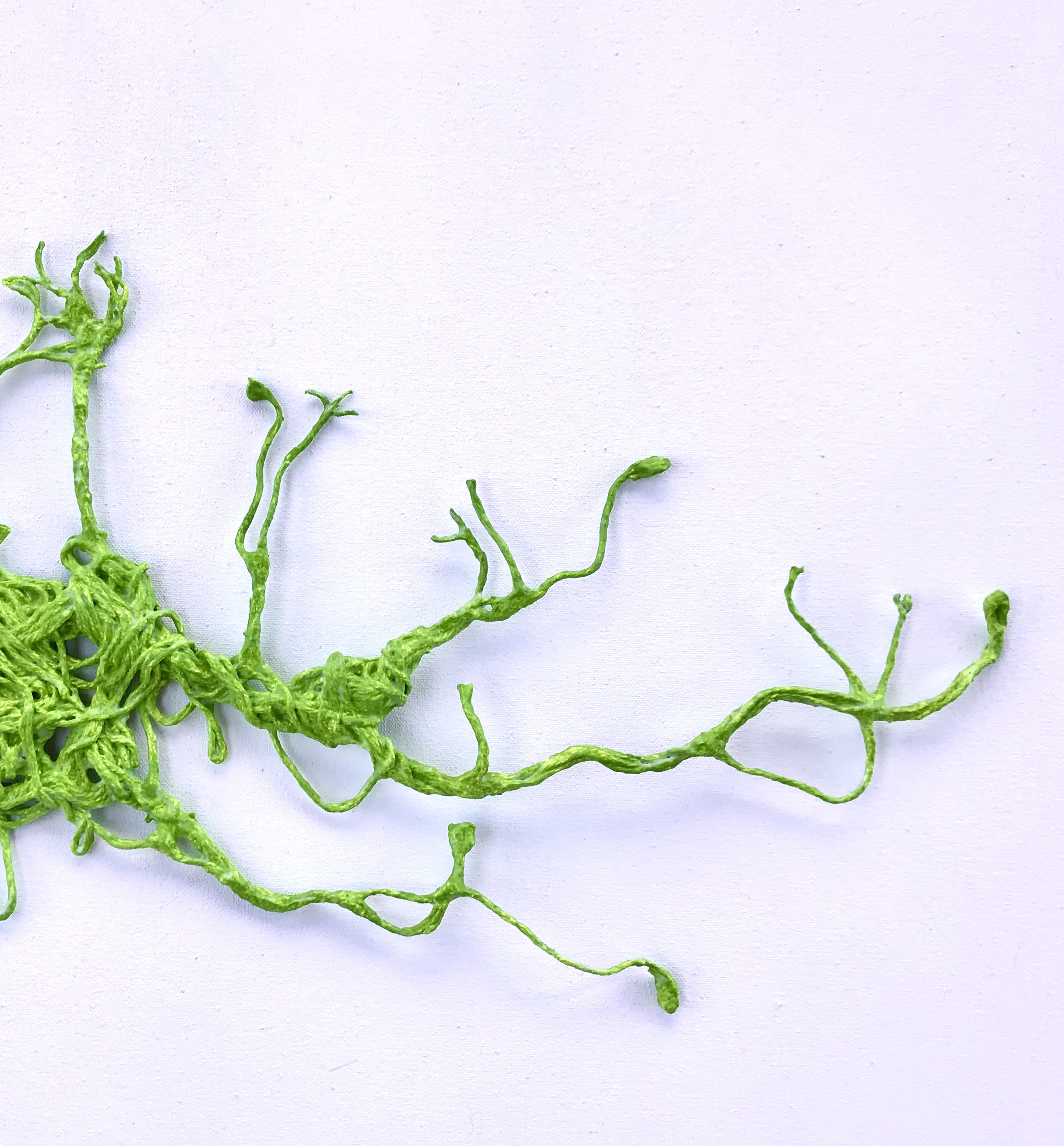 An abstract sculpture made from thread by MJ Seal that resembles a forest of vines
