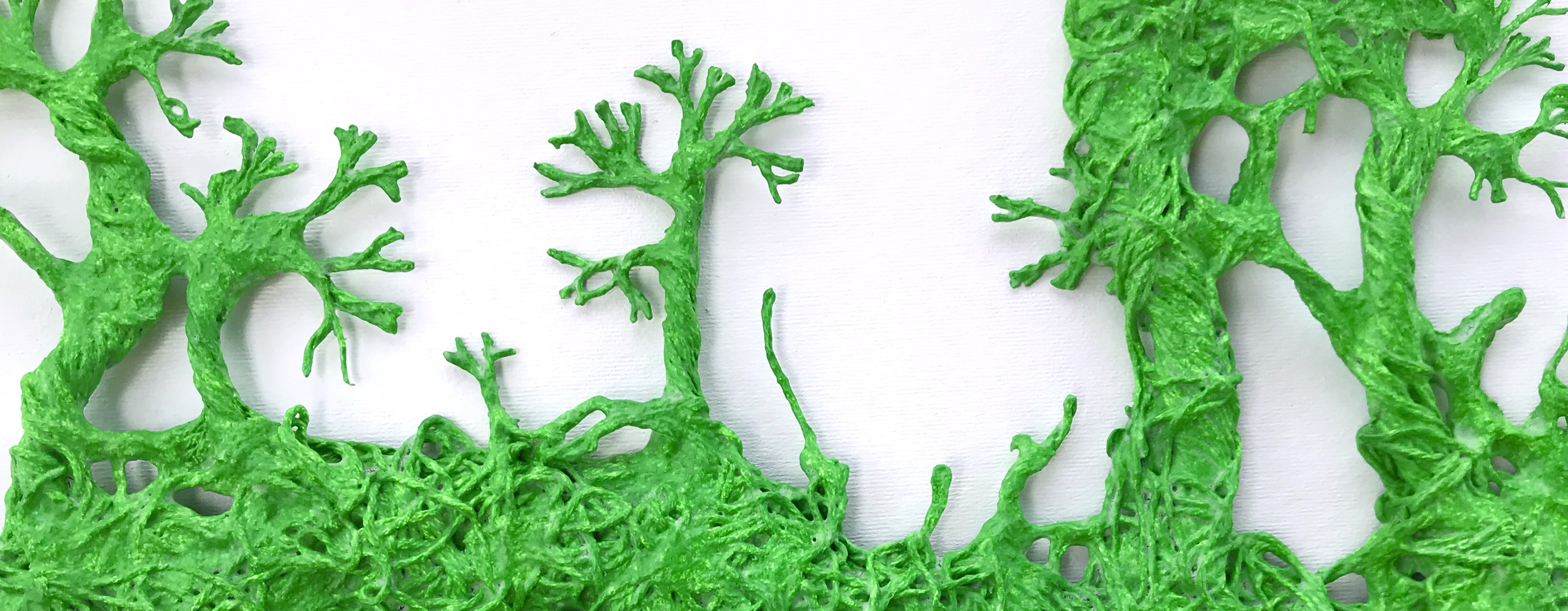 Detail of an original sculpture by MJ Seal made from thread and paper mache that resembles a green, twining forest of vines